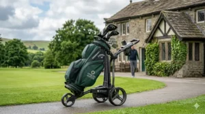 A detailed photograph of a premium dark green 'Callaway Over 60s Masters' golf bag, filled with a full set of specialized senior clubs and mounted securely on a modern electric Motocaddy trolley parked on a paved clubhouse pathway in the UK.
