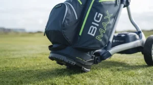 Base of a Big Max golf bag securely fitted onto an electric golf trolley, showing anti-twist locking technology.