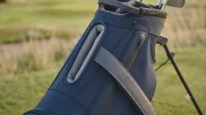 Integrated cart strap tunnel ensuring the golf bag remains secure on a trolley or cart.