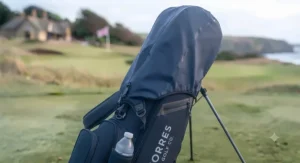 Golf bag shown with a rain hood attached for protection in British weather.