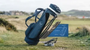 A lightweight golf bag being weighed, showing its minimal mass for easier transport.