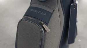 Ergonomic carry handle on a lightweight hybrid golf bag