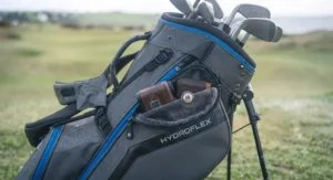 Wet-weather safe, dry-lining velour valuables pocket open on the side of the Motocaddy HydroFlex.