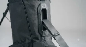 Demonstration of the cart strap pass-through on the golf bag.