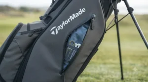 Organised storage pockets on a TaylorMade golf bag, showcasing space for waterproofs and golf accessories.