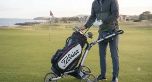 Titleist cart bag securely locked onto a push trolley, showcasing a stable base designed for standard UK golf trolleys.