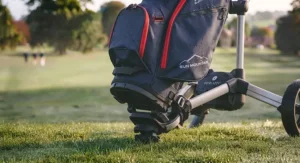 A detailed view focusing on the top section and club selection inside a standing golf bag outdoors.