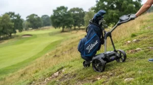 An electric golf trolley navigating a steep slope safely using automated downhill braking control.