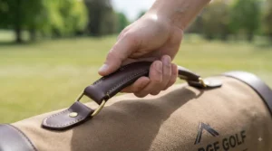 Close-up of an ergonomic handle on a premium golf ball shag bag designed to prevent back strain during repetitive practice.