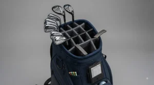 Interior view of a golf bag organiser showing separate club divider slots and accessory compartments.