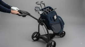 Golf bag organiser fitted securely for use on an electric golf trolley on a British fairway.