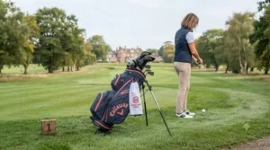 Functional ladies golf stand bag propped up by its retractable legs near the 1st tee box.