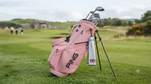 Lightweight pink golf stand bag with dual strap system for comfortable carrying.