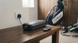 Close-up of a lithium battery being charged for a remote control golf trolley in a UK clubhouse locker room.