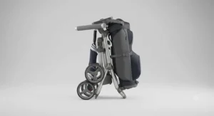 Fully folded push golf trolley demonstrating compact storage inside a car boot.