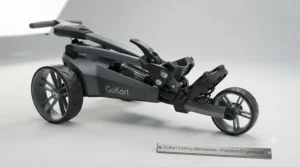 Compact GoKart electric golf trolley packed neatly into the boot of a hatchback car.