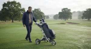 Golfer walking the fairway using an ergonomic 3-wheel push golf trolley.