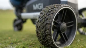 Durable rear wheel tread on an MGI golf trolley built for wet winter course conditions.