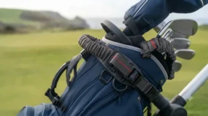 Adjustable upper and lower bag straps securing a standard cart bag onto a compact electric golf trolley frame.